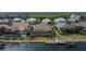 Aerial view of waterfront home with private dock and pool at 721 Manns Harbor Dr, Apollo Beach, FL 33572