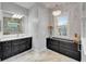 Bathroom featuring double sink vanity, with marble countertops and floors at 721 Manns Harbor Dr, Apollo Beach, FL 33572