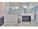 Elegant bathroom with a large walk-in shower and heated towel rack at 721 Manns Harbor Dr, Apollo Beach, FL 33572