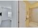 Small bathroom with a tub shower combo and yellow walls at 721 Manns Harbor Dr, Apollo Beach, FL 33572
