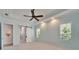 Bedroom featuring tray ceiling, barn door, and lots of natural light at 721 Manns Harbor Dr, Apollo Beach, FL 33572