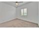 Bright bedroom featuring natural light through window and neutral carpet at 721 Manns Harbor Dr, Apollo Beach, FL 33572