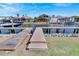 Steps down to a spacious wooden boat dock with multiple boat lifts at 721 Manns Harbor Dr, Apollo Beach, FL 33572