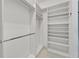 Organized walk-in closet providing ample storage space and convenience at 721 Manns Harbor Dr, Apollo Beach, FL 33572