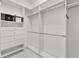 Spacious walk-in closet with custom shelving for optimal organization at 721 Manns Harbor Dr, Apollo Beach, FL 33572