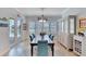 Casual dining area with hardwood floors, plantation shutters, and access to pool at 721 Manns Harbor Dr, Apollo Beach, FL 33572