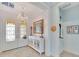 Elegant entryway with chandelier, console table, and decorative niche at 721 Manns Harbor Dr, Apollo Beach, FL 33572