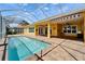 The house exterior includes a screened-in lanai with a pool and a brick patio at 721 Manns Harbor Dr, Apollo Beach, FL 33572