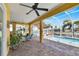 Relaxing pool area with covered patio and canal view at 721 Manns Harbor Dr, Apollo Beach, FL 33572