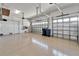 Open garage featuring epoxy flooring, and two garage doors at 721 Manns Harbor Dr, Apollo Beach, FL 33572