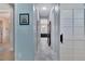 Bright hallway with light walls and tile flooring at 721 Manns Harbor Dr, Apollo Beach, FL 33572