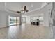Spacious living room with access to kitchen, pool, and lots of natural light at 721 Manns Harbor Dr, Apollo Beach, FL 33572