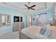 Main bedroom with a large bed, dresser, and barn door at 721 Manns Harbor Dr, Apollo Beach, FL 33572