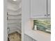 Walk-in pantry featuring ample metal shelving for organized storage at 721 Manns Harbor Dr, Apollo Beach, FL 33572