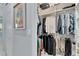 Large walk-in closet with ample hanging space and shelving at 721 Manns Harbor Dr, Apollo Beach, FL 33572