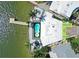 An overhead shot displaying the layout of the home with a pool and dock on the waterfront at 803 Bay Point Dr, Madeira Beach, FL 33708