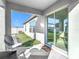 Covered patio with glass sliding doors leading to the backyard at 8849 Little Bluestem Dr, Land O Lakes, FL 34637