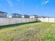 Large grassy backyard with a privacy fence at 8849 Little Bluestem Dr, Land O Lakes, FL 34637