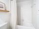 Clean bathroom with white subway tile, bathtub, and shower curtain at 8849 Little Bluestem Dr, Land O Lakes, FL 34637