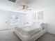 Spacious bedroom with large bed and window at 8849 Little Bluestem Dr, Land O Lakes, FL 34637