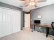 Bright bedroom with double doors and workspace at 8849 Little Bluestem Dr, Land O Lakes, FL 34637