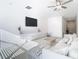 Living room with sectional sofa, large TV, and light wood coffee table at 8849 Little Bluestem Dr, Land O Lakes, FL 34637