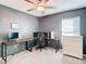 Home office with L-shaped desk, computer, and chest of drawers at 8849 Little Bluestem Dr, Land O Lakes, FL 34637