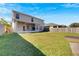 Spacious backyard with home and wooden fence at 11217 Avery Oaks Dr, Tampa, FL 33625