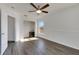 Bright bedroom with wood-look floors, ceiling fan, and walk-in closet at 11217 Avery Oaks Dr, Tampa, FL 33625