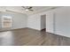 Spacious bedroom featuring wood-look floors and a ceiling fan at 11217 Avery Oaks Dr, Tampa, FL 33625