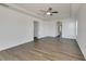 Large bedroom with wood-look flooring and access to bathroom at 11217 Avery Oaks Dr, Tampa, FL 33625