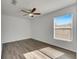 Spacious bedroom with wood-look floors and ceiling fan at 11217 Avery Oaks Dr, Tampa, FL 33625
