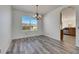 Bright dining room with hardwood floors and a chandelier at 11217 Avery Oaks Dr, Tampa, FL 33625