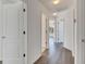 Clean and bright hallway with doors to bedrooms at 11217 Avery Oaks Dr, Tampa, FL 33625