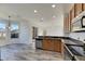 Modern kitchen with stainless steel appliances and wood cabinets at 11217 Avery Oaks Dr, Tampa, FL 33625