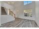 Spacious living room with hardwood floors and large windows at 11217 Avery Oaks Dr, Tampa, FL 33625