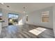 Bright living room featuring wood-look floors and sliding glass doors at 11217 Avery Oaks Dr, Tampa, FL 33625