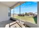 Screened porch with view of backyard and neighborhood at 11217 Avery Oaks Dr, Tampa, FL 33625