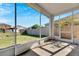 Spacious screened porch overlooking backyard at 11217 Avery Oaks Dr, Tampa, FL 33625