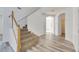 Modern staircase with wooden railing and carpeted steps at 11217 Avery Oaks Dr, Tampa, FL 33625