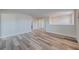 Bright bonus room with wood-look floors and access to other rooms at 11314 Leland Groves Dr, Riverview, FL 33579