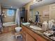 Clean bathroom with a bathtub, granite countertop, and updated vanity at 133 80Th N Ave, St Petersburg, FL 33702