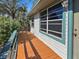 Wooden deck with railings, adjacent to the house exterior at 133 80Th N Ave, St Petersburg, FL 33702