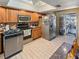 Kitchen with stainless steel appliances and access to outdoor patio at 133 80Th N Ave, St Petersburg, FL 33702