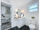 Clean and contemporary bathroom with dark geometric tile floor at 2310 W Ivy St, Tampa, FL 33607