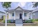 Charming bungalow with a renovated front porch and landscaped yard at 2310 W Ivy St, Tampa, FL 33607