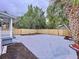Private backyard with a large concrete patio and wooden fence at 2310 W Ivy St, Tampa, FL 33607