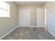 Simple bedroom featuring tile floors and a double-door closet at 26237 Blackjack St, Brooksville, FL 34601