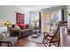 Cozy living room featuring a brown sofa and rocking chair at 4925 38Th S Way # A104, St Petersburg, FL 33711