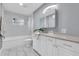 Modern bathroom with white cabinets and a walk-in shower at 5021 69Th N Way, St Petersburg, FL 33709